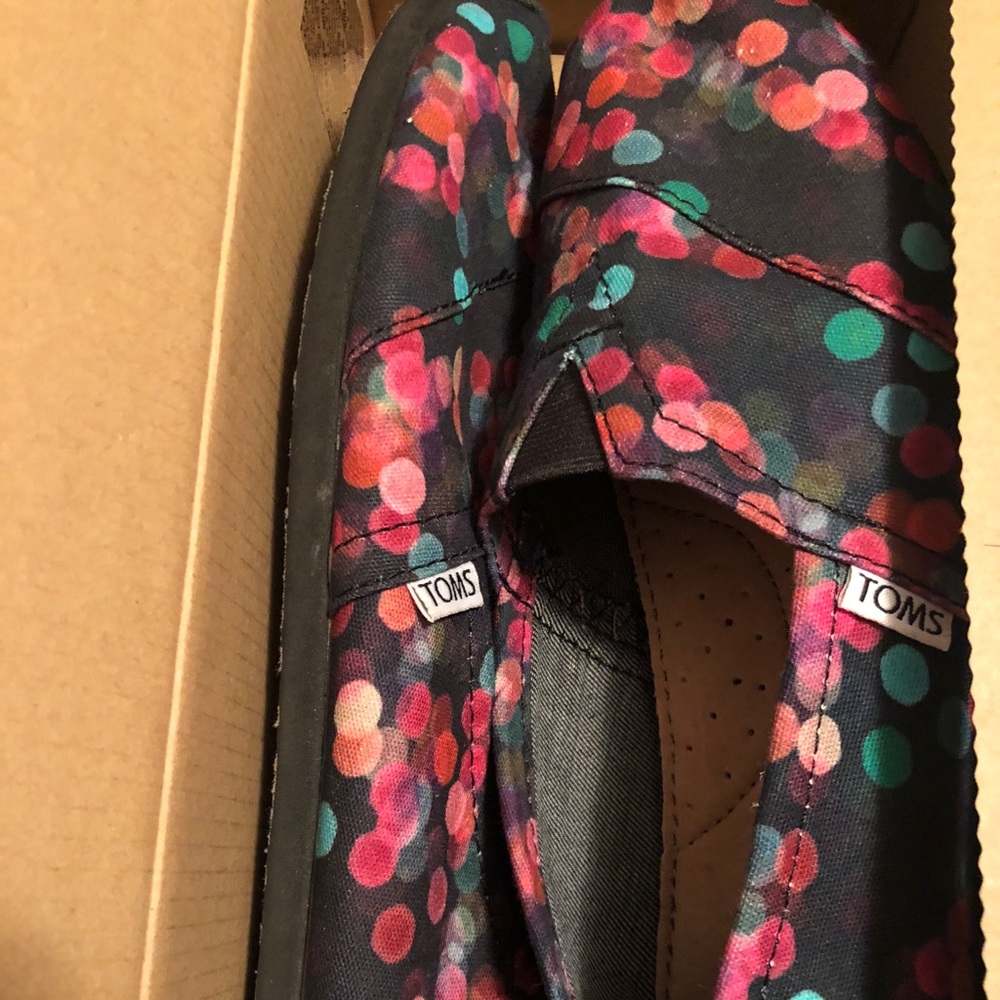 Toms black and dotted shoes. Size 9